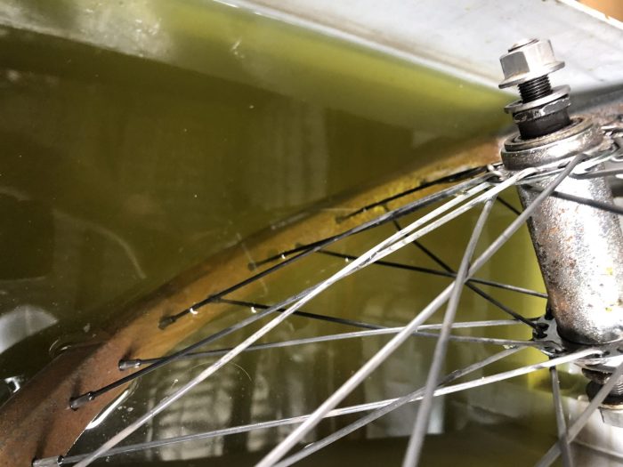 rust being removed from a bicycle rim