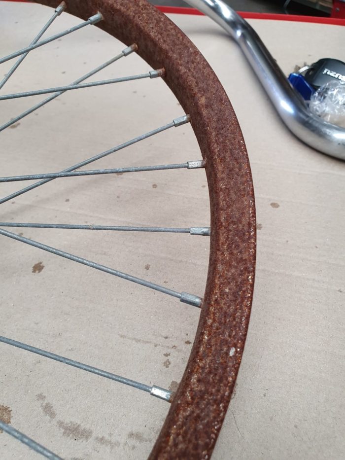 heavily rusted bicycle rim